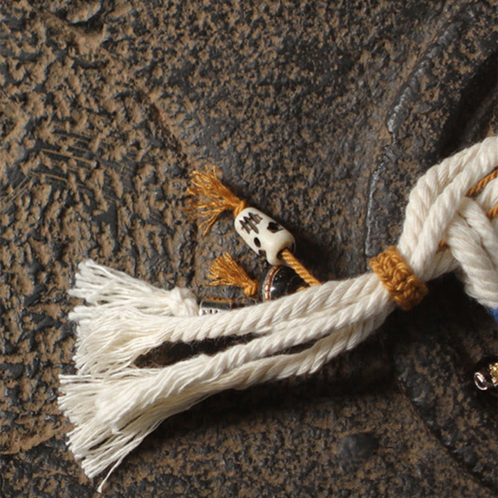 Armband – Glück & Wohlstand & Stärke mit weißen Quasten Naturstein.