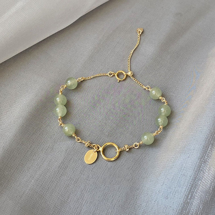 Armband Jade Gold Wohlstand mit grünen Natursteinen elegant draped