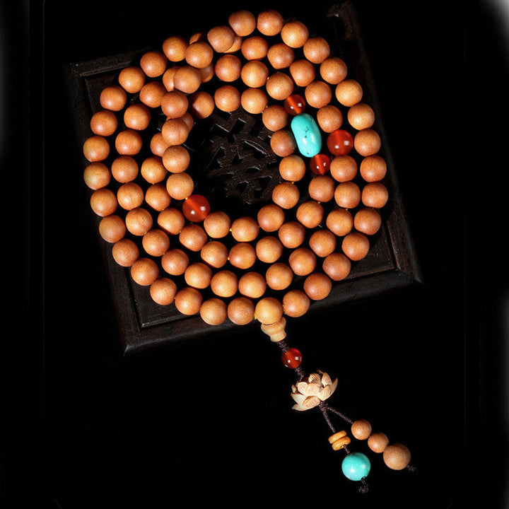 Armband Sandelholz Lotus mit Türkis und roten Perlen