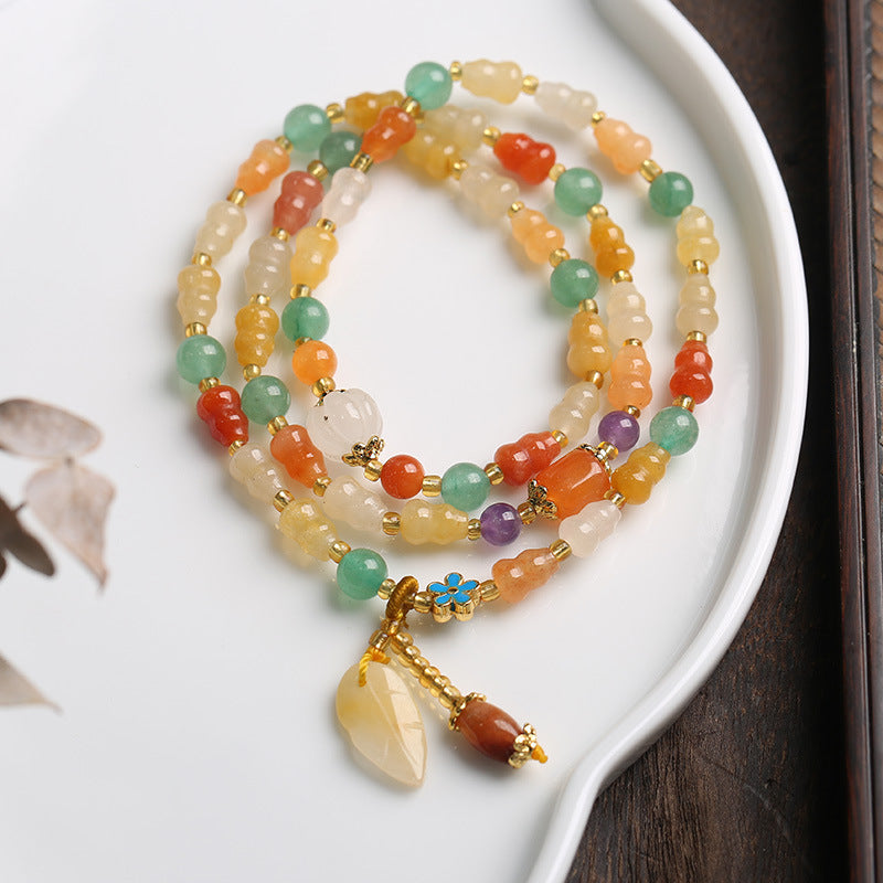 Armband Jade – Wohlstand mit bunten Steinen und goldenem Anhänger