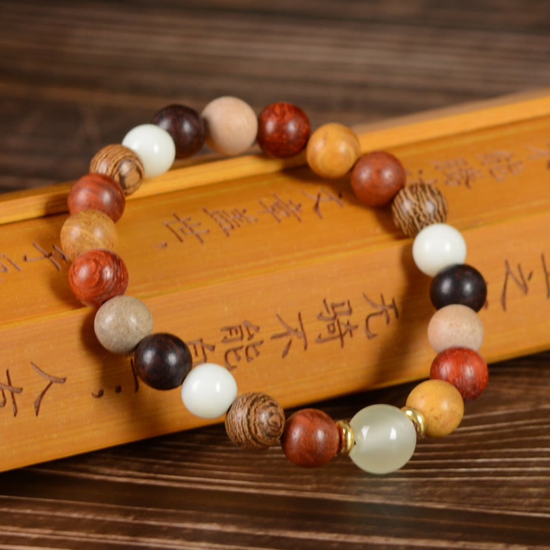 Armband Sandelholz Ebenholz mit weißen Perlen Friedensdesign elastisch