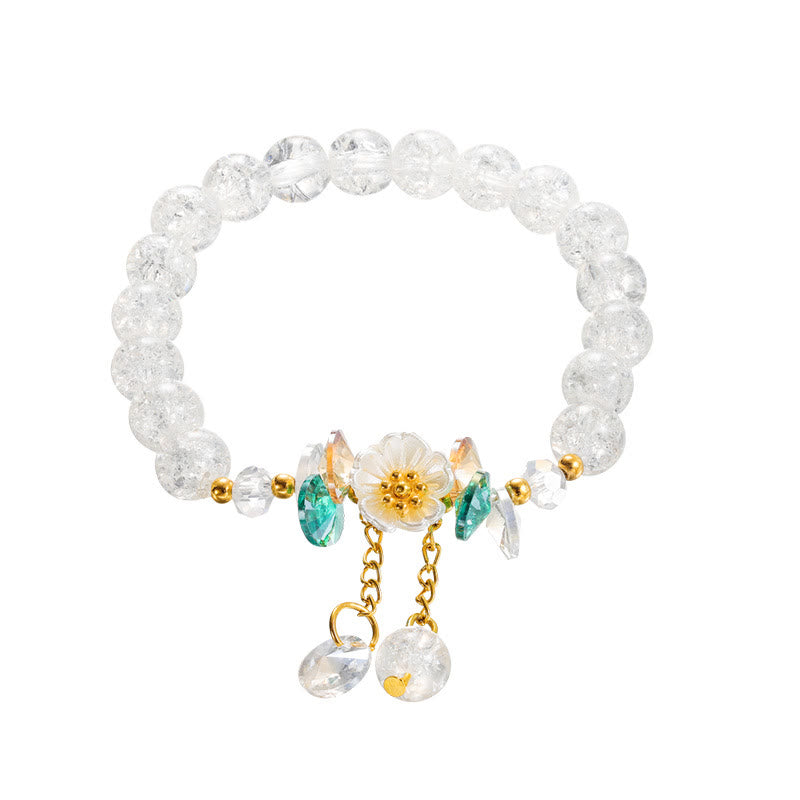 Armband Blume Glas mit grünen Steinen und goldenen Perlen elegant.