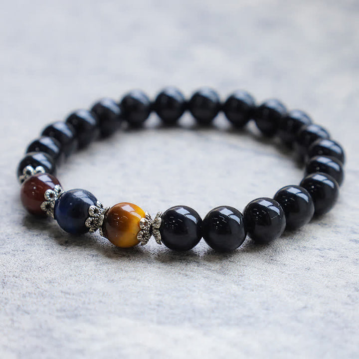 Armband Schwarzer Obsidian Tigerauge Naturstein elastisch kraftvoll elegant.