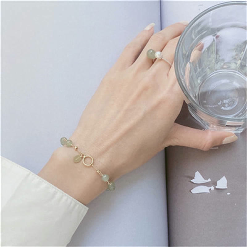 Armband Jade – Glück grüne Steine goldene Ringe Handgelenk elegant