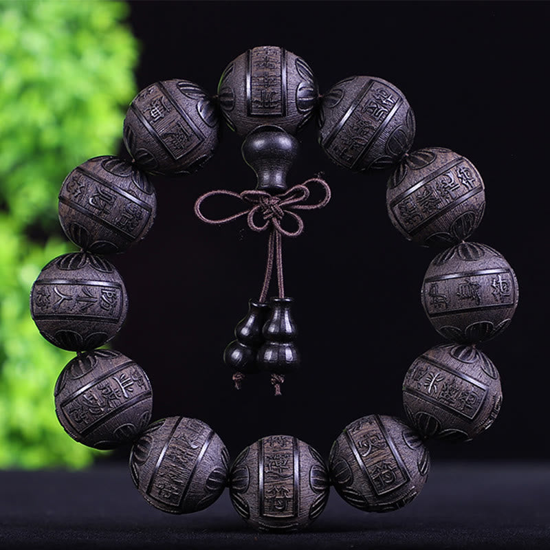 Chinesisches Tierkreis Armband mit schwarzen Steinkugeln und Kupferschnur.