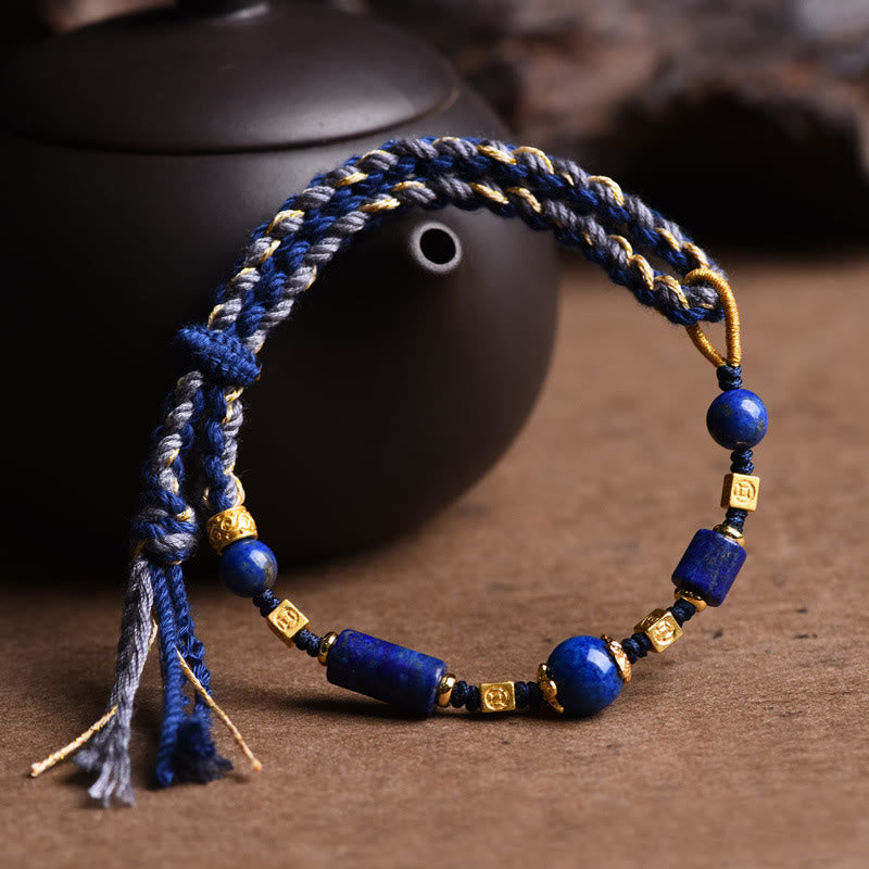 Armband Lazurit Perle Positiv blau gold Perlen Handgelenk getragen