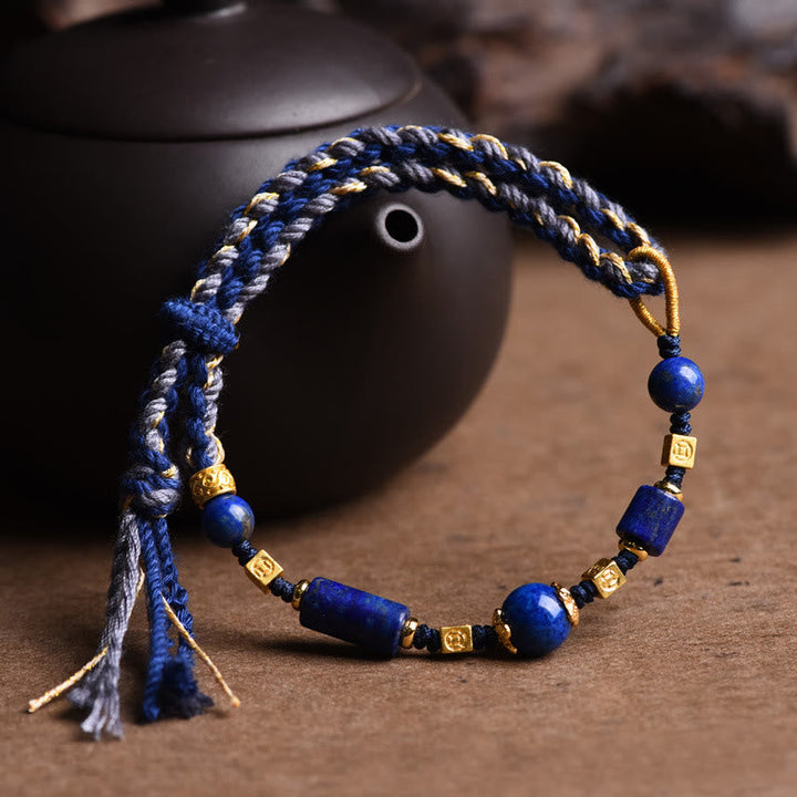 Armband Lazurit Perle Positiv blau gold Perlen Handgelenk getragen