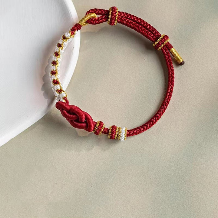 Armband Pfirsichblüte Glück Liebe rotes Gold geflochtenes Seidenband elegant