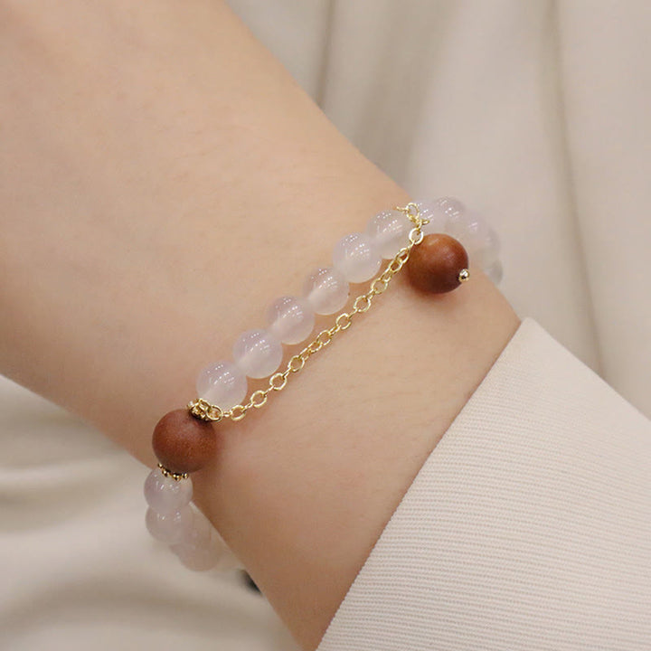 Armband Sandelholz Fu-Zeichen Schutz Rosenquarz Perlen Gold Kette getragen