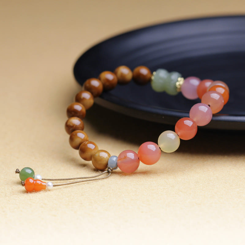 Armband Achat Jade Schutz Wohlstand braun orange rosa Perlen elastisch