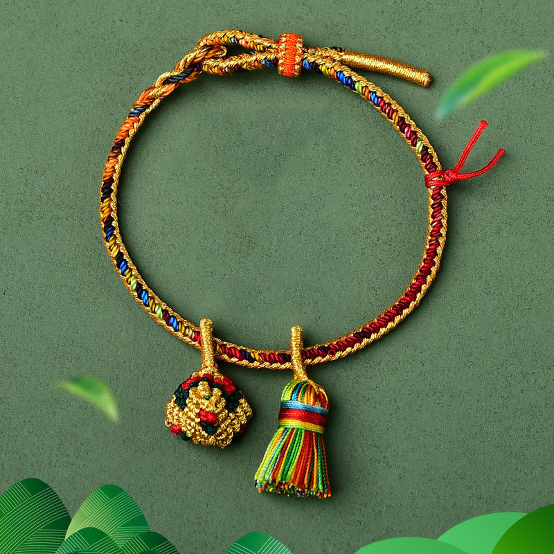 Buntes Glück Armband mit Zongzi Anhänger golden elastisch Baumwolle.