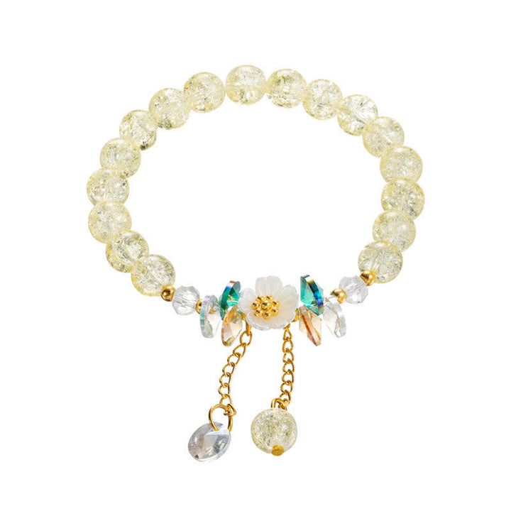 Armband Blume Glas mit gelben Perlen und Blütenanhänger elastisch