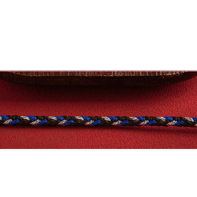 Armband Mehrfarbig Glücksband blau schwarz beige Seil Nahaufnahme Textil