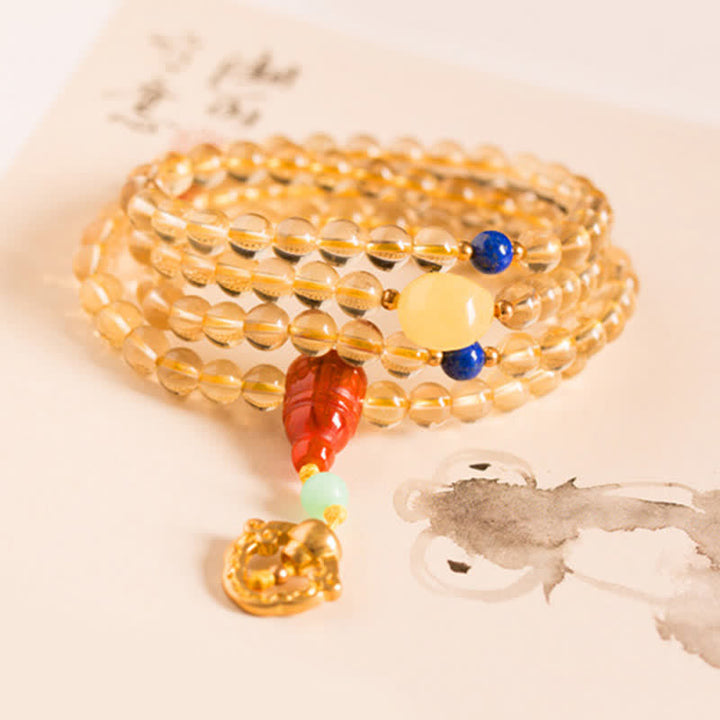 Mala Armband mit goldenem Citrin und roten Achat Perlen elastisch