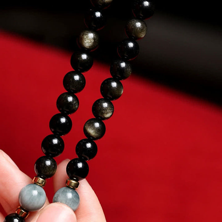 Mala Tigerauge Obsidian Armband schwarze Perlen Wohlstand Handgelenk getragen