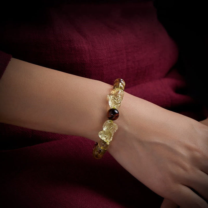 Armband Tigerauge Citrin Pixiu Handgelenk getragen goldene Perlen Schutz