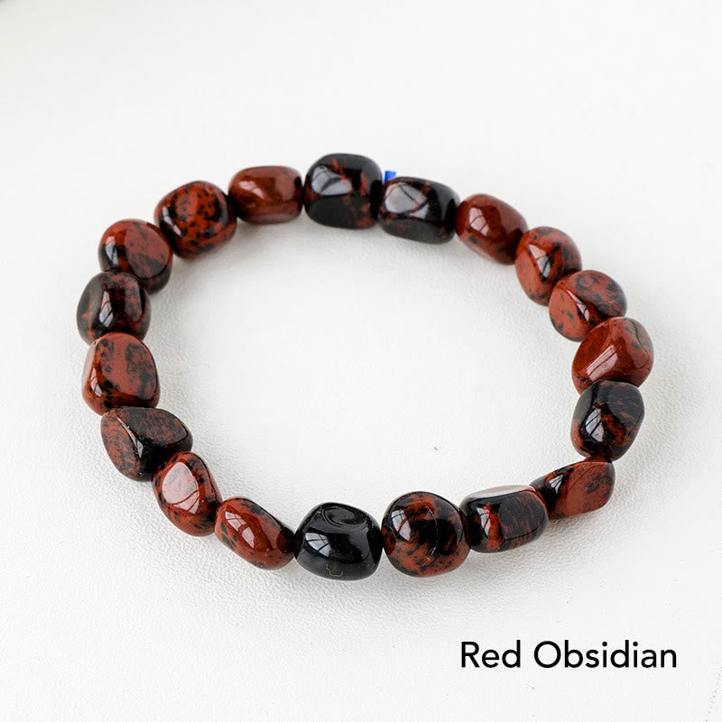 Rotes Obsidian Armband Kristall mit glänzenden Perlen elastisch.