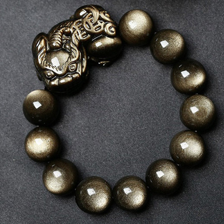 Armband Obsidian Pixiu Schutz goldene Perlen Naturstein elastisch.