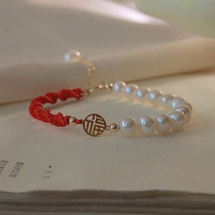 Armband Perle – Schutz & Glück mit roten Fäden und Goldakzenten