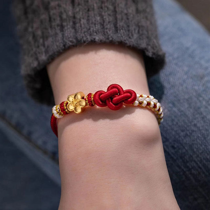 Armband Pfirsichblüte Rot Gold Herz Glück Liebe Handgelenk getragen