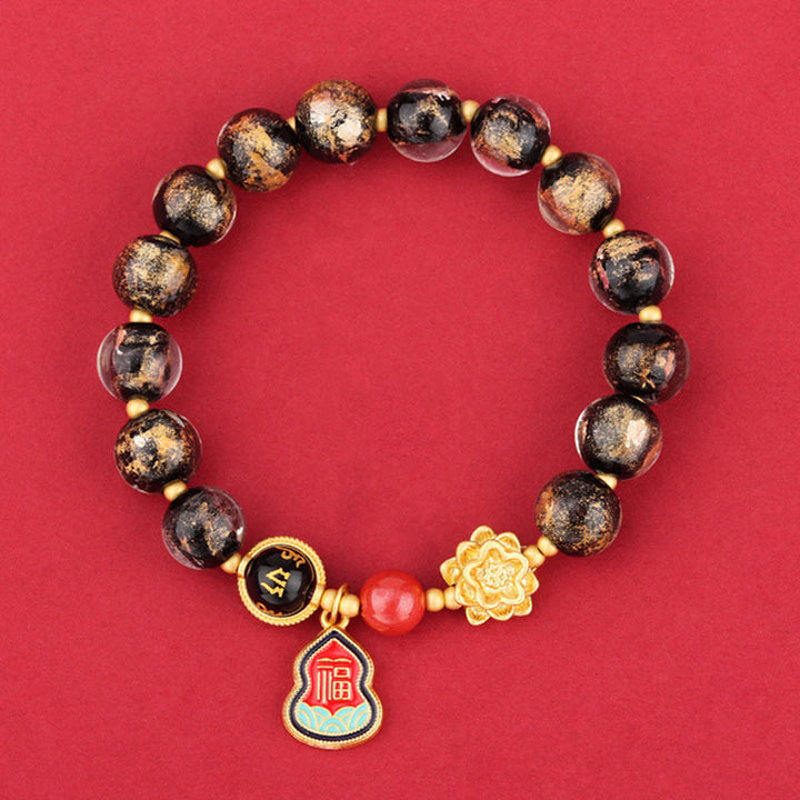 Armband Om Mani Padme Hum Glück mit Obsidian Perlen goldenen Akzenten