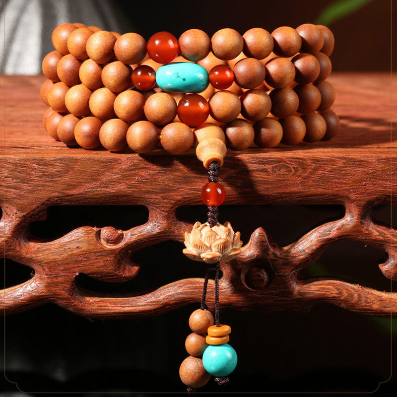 Armband Sandelholz Lotus Perlen Türkis Rot Holzperlen Schmuck.