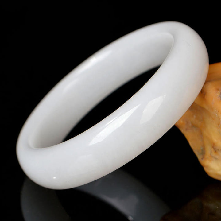 Weißes Jade Armband elastisch glänzend Naturstein Wohlstand Segen.