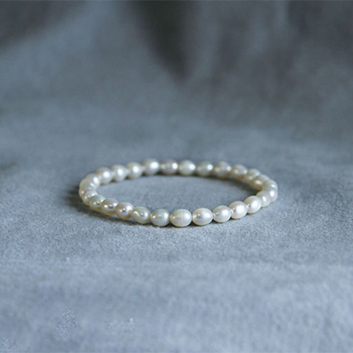 Armband Perle – Heilung weiße Perlen elastisch natürlich elegant schlicht