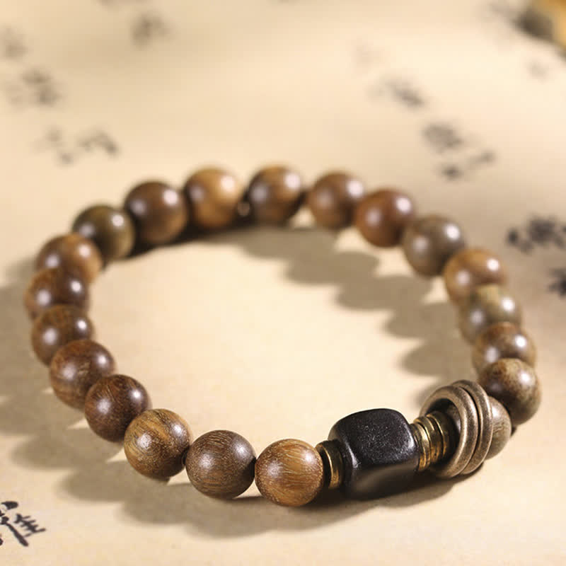 Armband Sandelholz Kristall – Frieden braune Perlen schwarze Akzente elastisch