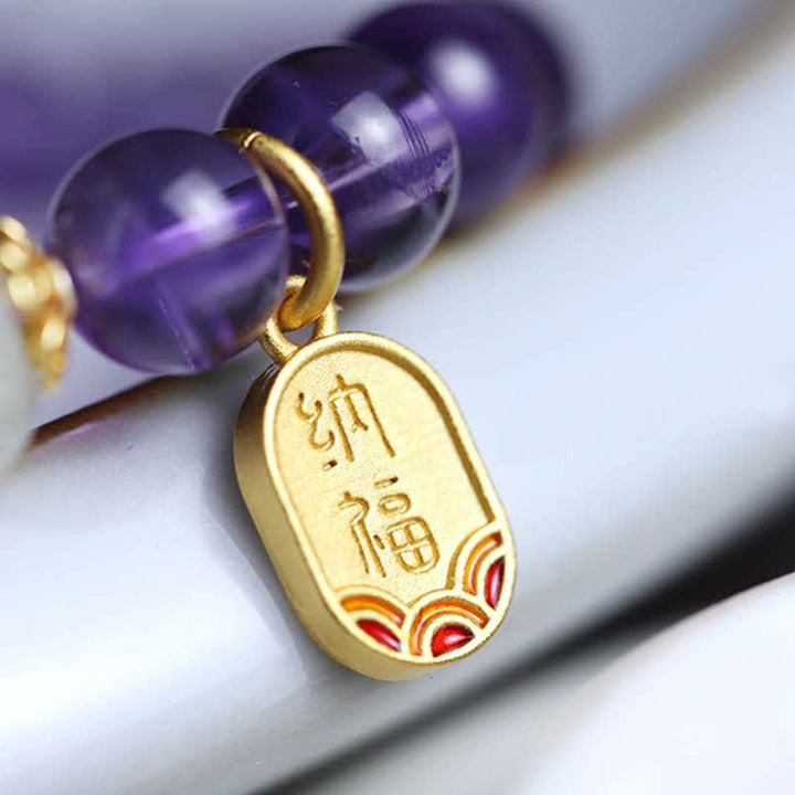 Armband Amethyst Kristall lila Perlen goldener Anhänger Schrift