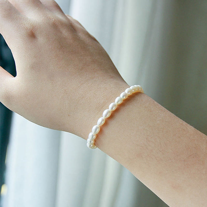 Armband Perle – Heilung weiße Perlen elastisch am Handgelenk getragen