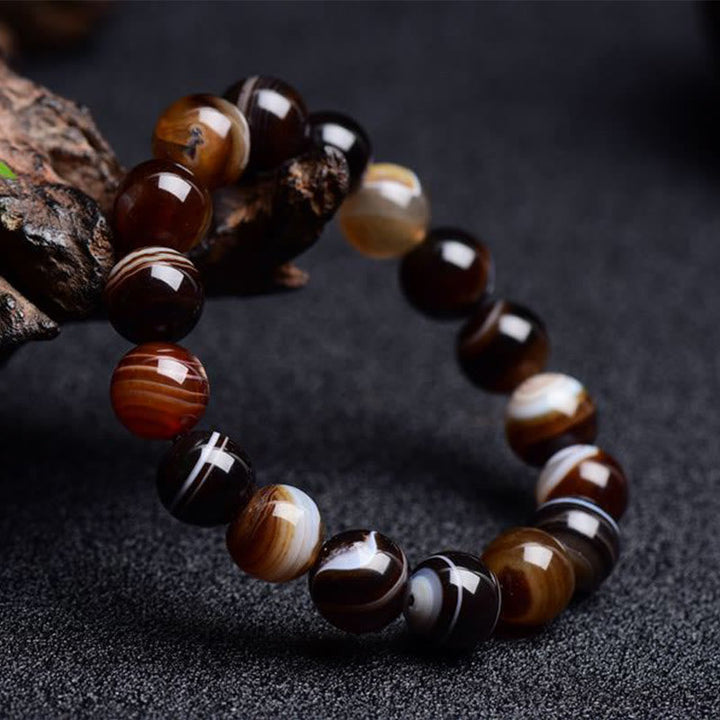 Armband Onyx – Glück Energie mit braunen und schwarzen Steinen elegant.