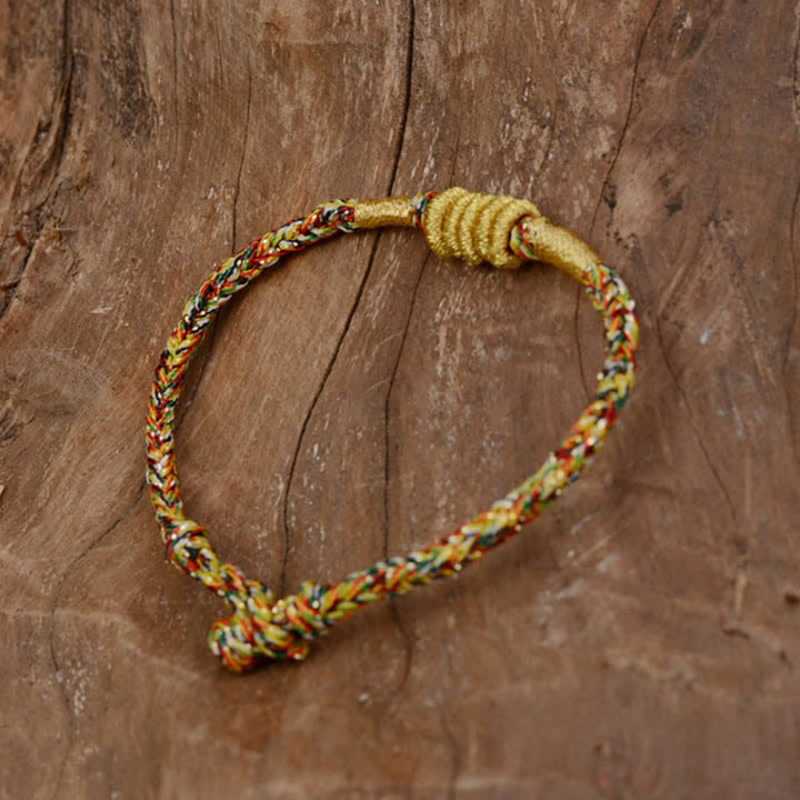 Armband bunt geflochten Knoten Schutz gelb rot grün Handgelenk