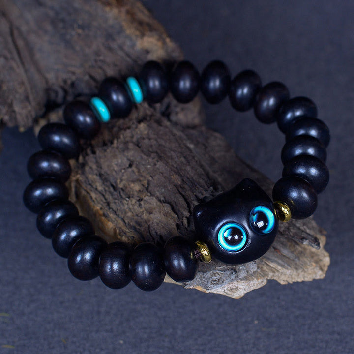 Armband Ebenholz Katze schwarze Perlen blaue Augen Naturstein elastisch