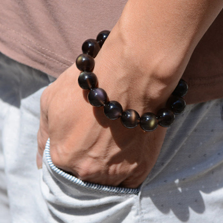 Armband Regenbogen Obsidian schwarze Perlen Handgelenk elastisch getragen
