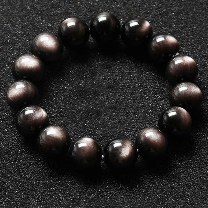 Obsidian Armband Silber schwarze Perlen Schutz Flachaufnahme dunkler Hintergrund