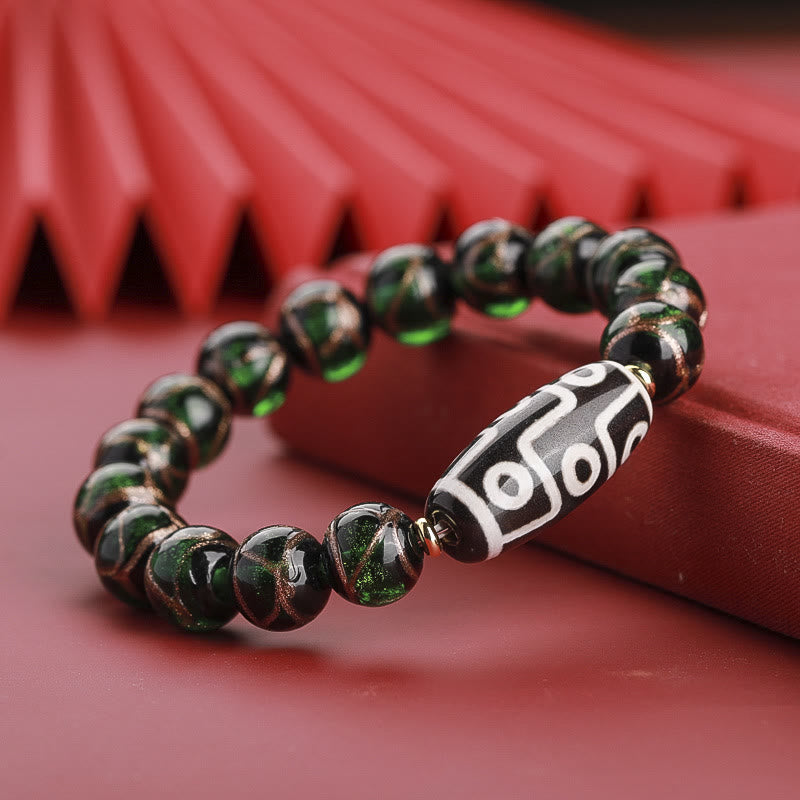 Armband – Wohlstand Balance mit schwarzen Perlen und Dzi-Bead Anhänger