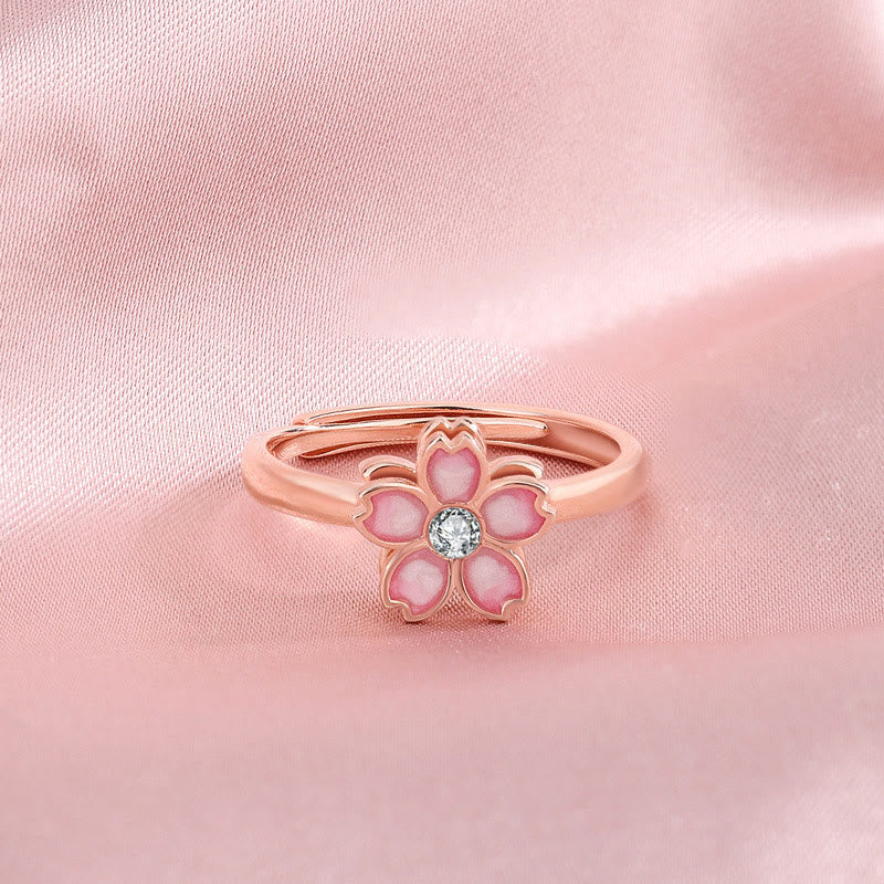 Roségoldenes Blüten-Armband mit rosa Steinen und Kristall-Mittelpunkt elegant.