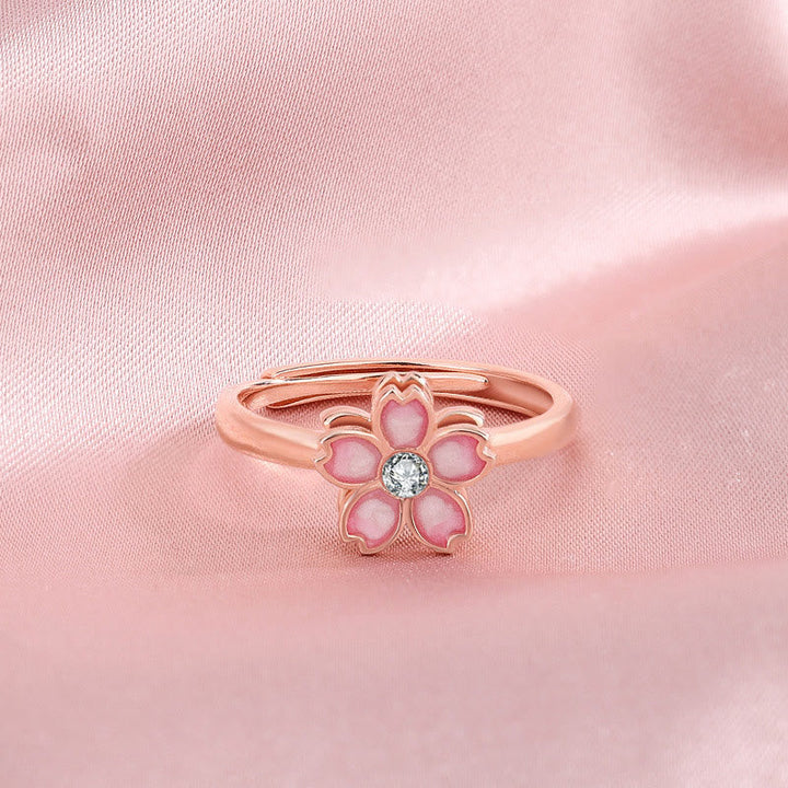 Roségoldenes Blüten-Armband mit rosa Steinen und Kristall-Mittelpunkt elegant.