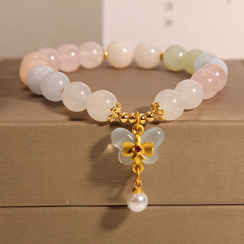 Armband Schmetterling – Balance mit Rosenquarz und Goldakzenten elegant.