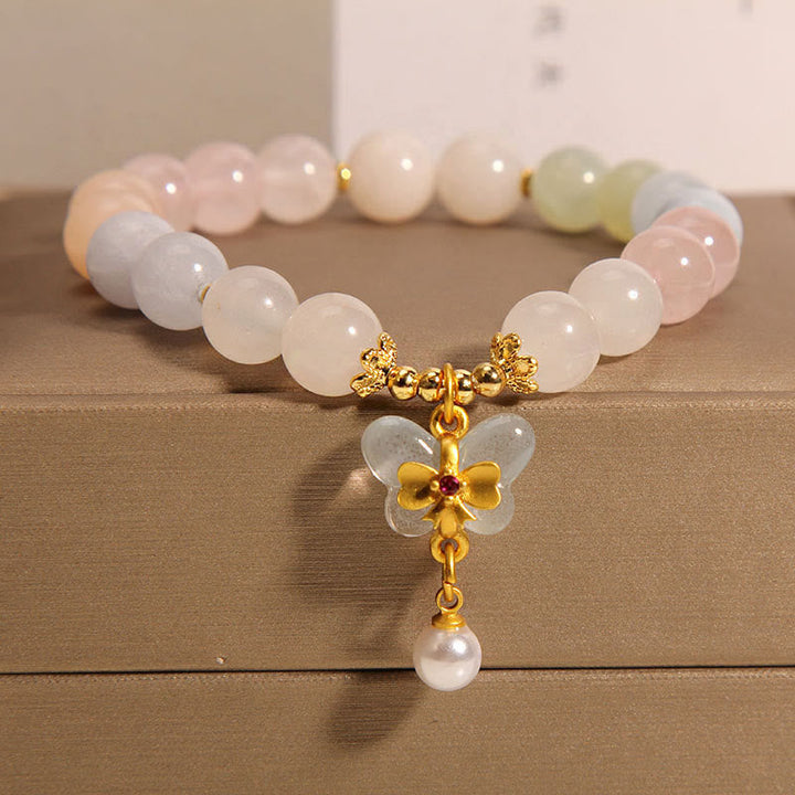 Armband Schmetterling – Balance mit Rosenquarz und Goldakzenten elegant.