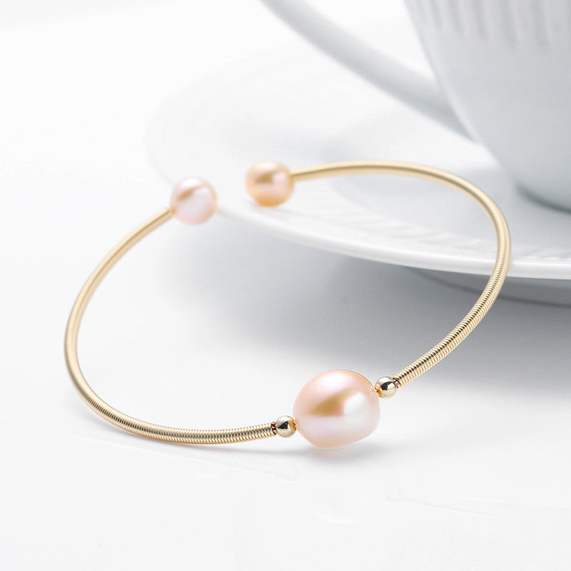 Goldenes Armband Perle – Wohlstand mit rosafarbener Perle elegant.