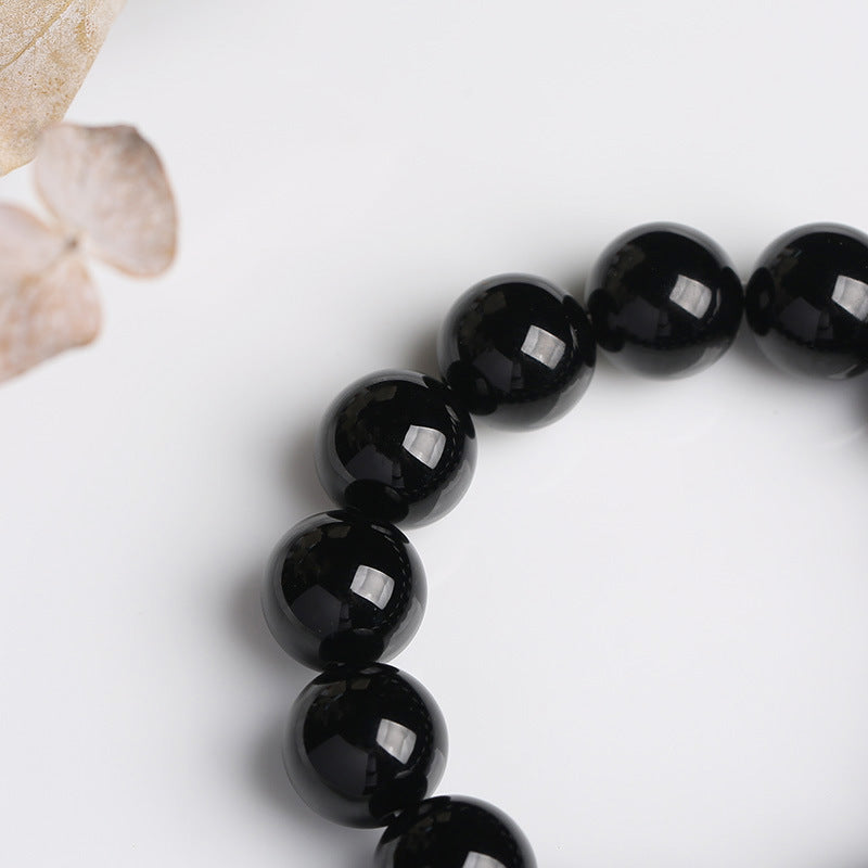 Armband Schwarzer Onyx – Glück mit glänzenden Perlen elegant arrangiert