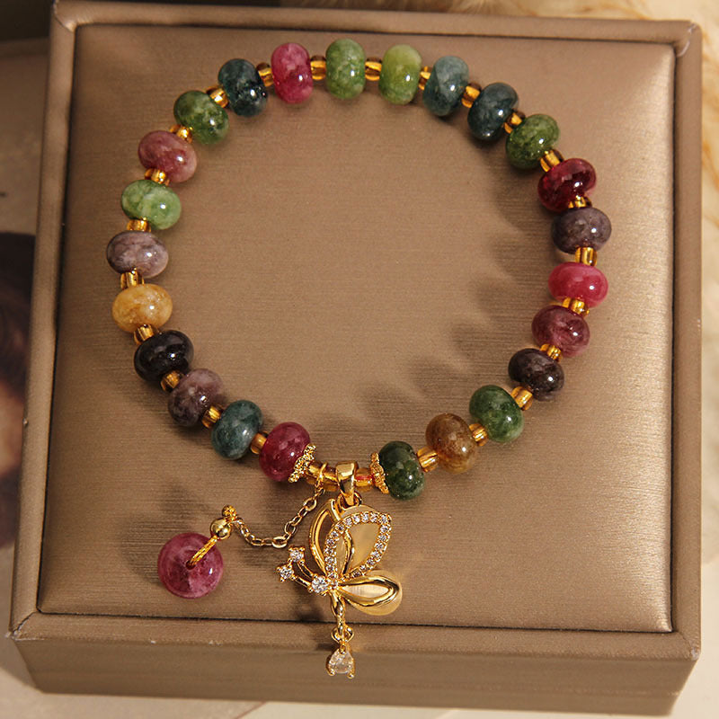 Armband Schmetterling mit Turmalin und goldenen Akzenten in Geschenkbox.