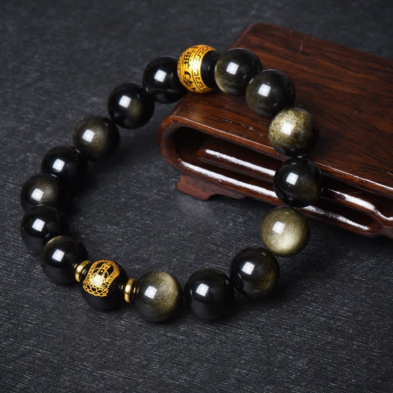 Obsidian Armband mit goldenen Perlen und Holzschatulle Dekoration.