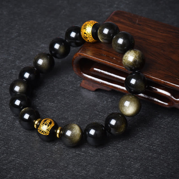 Obsidian Armband mit goldenen Perlen und Holzschatulle Dekoration.
