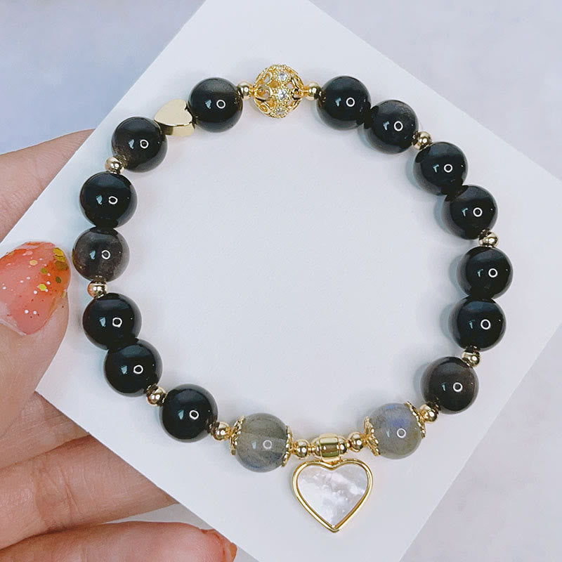 Schwarzes Obsidian Armband Silber Herzanhänger elegantes Schmuckstück Handgelenk