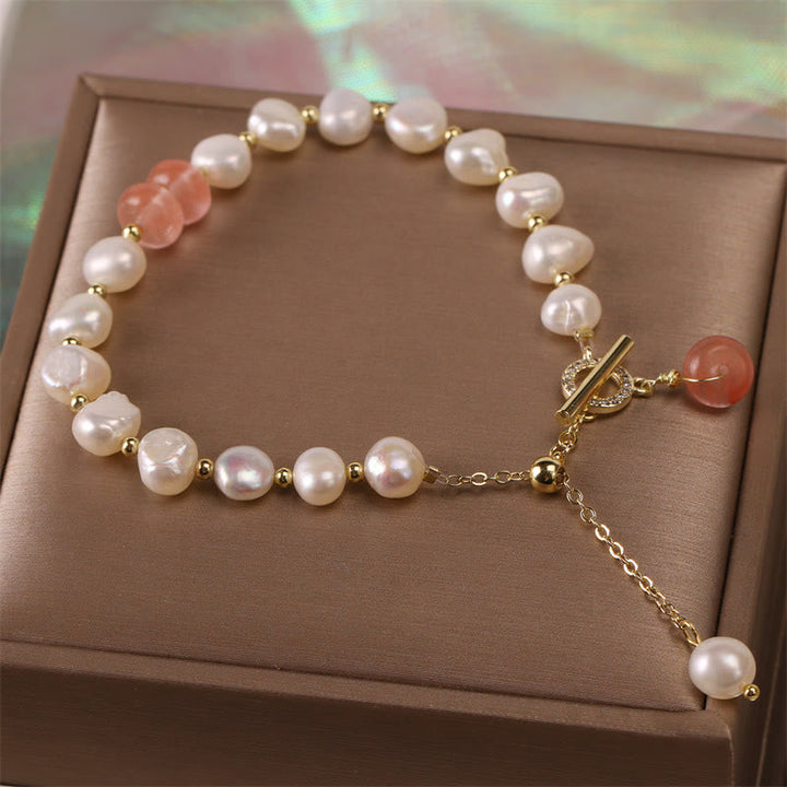 Armband Erdbeerquarz Perle Heilung Energie goldene Perlenkugeln elegant.