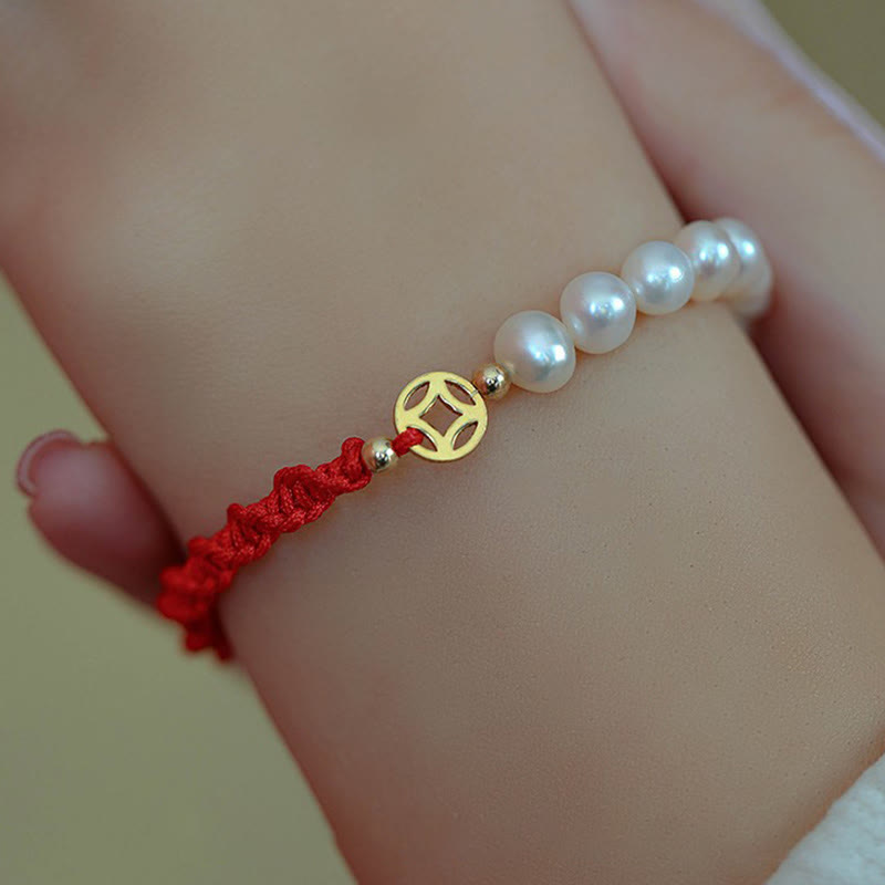 Armband Perle – Schutz & Glück mit roten Kordeln Goldakzenten elegant