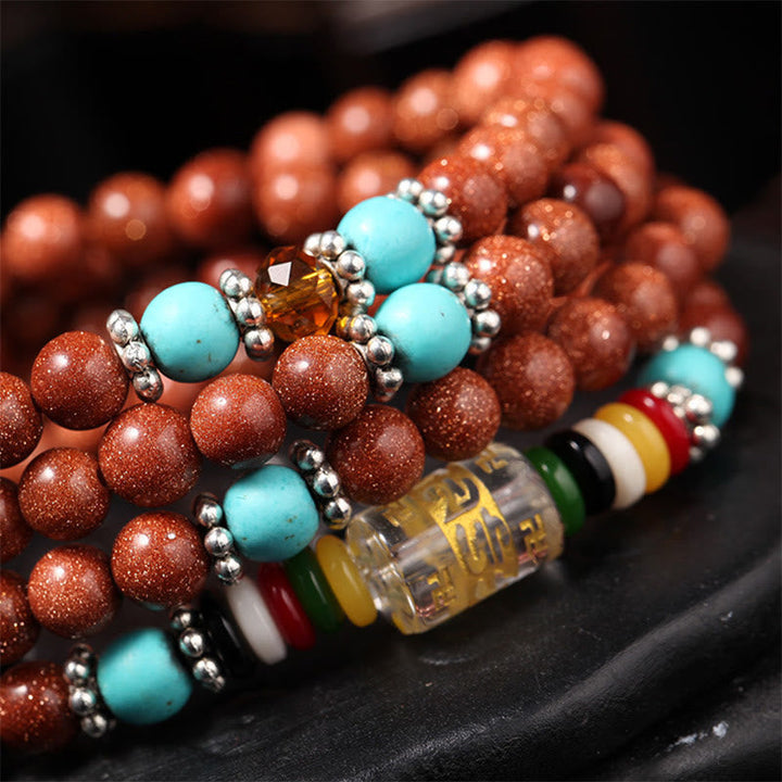 Armband Om Mani Padme Hum Balance mit roten und türkisen Perlen